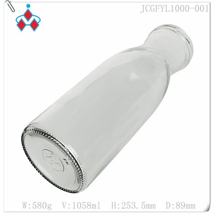 Glass orange juice bottle in stock